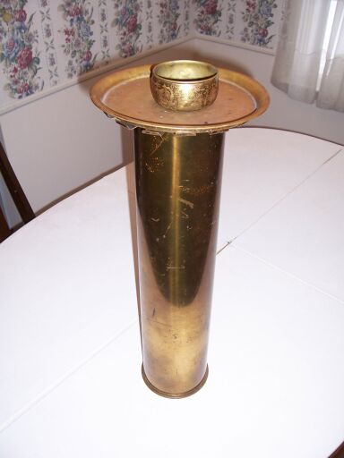 Ash tray with a stand made from an artillery shell casing.