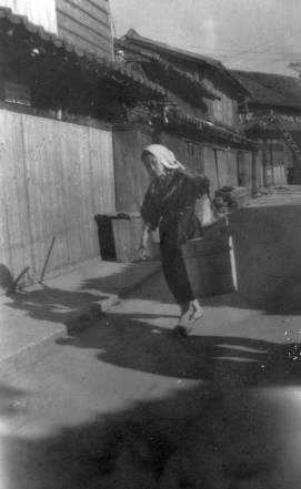 Woman Carrying Bucket