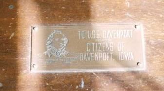 Brass Plaque that is mounted on the top right side of the radio cabinet. Inscription reads: "TO USS DAVENPORT from the CITIZENS OF DAVENPORT, IOWA"; Image is that of Col. Geo. Davenport, the city's namesake and founder.